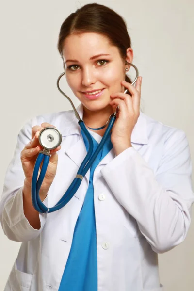 Doctor with a stethoscope listening — Stock Photo, Image