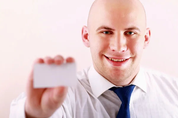 Business man holding blank white business card — Stock Photo, Image