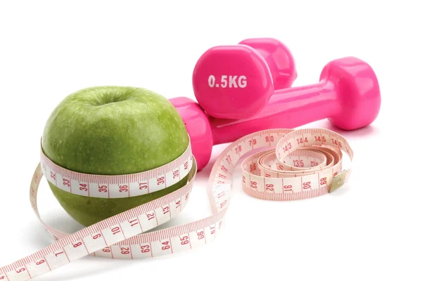 Apple, measuring type and dumbbell — Stock Photo, Image