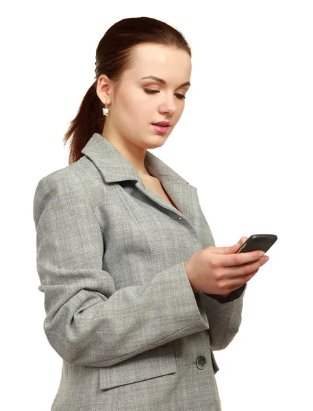 Hermosa mujer con un teléfono en la mano — Foto de Stock