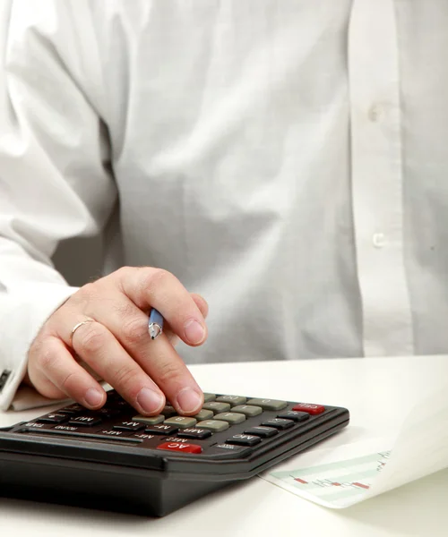 Young man calculating bills at home — Stock Photo, Image