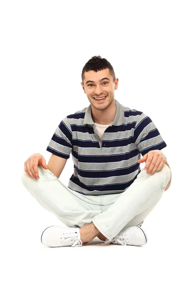 A young guy sitting on the floor — Stock Photo, Image