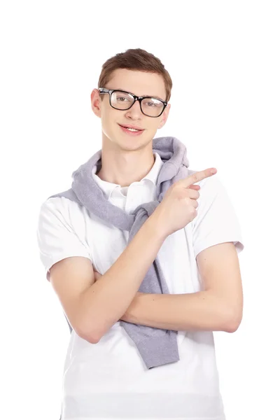 Portrait of a happy young man pointing at something — Stock Photo, Image