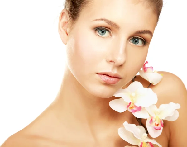 A young woman with orchid — Stock Photo, Image