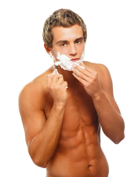 Closeup of a young man shaving — Stock Photo, Image