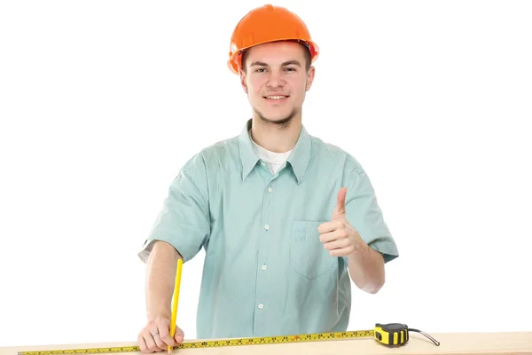 Ein junger Arbeiter zeigt ok — Stockfoto