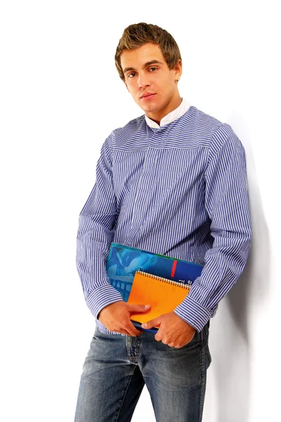 Молодой парень из колледжа с книгами — стоковое фото