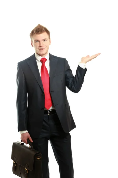 Portrait of a happy young man pointing — Stock Photo, Image