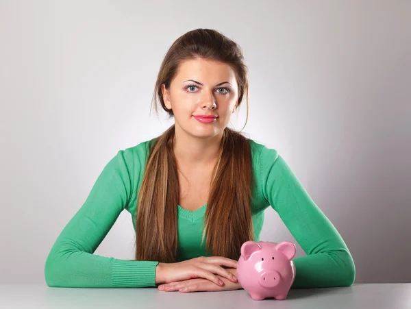 Young beautiful woman with piggy bank — Stock Photo, Image