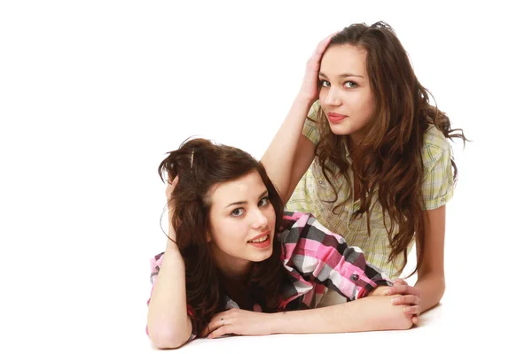 Two pretty college girls lying on the floor — Stock Photo, Image