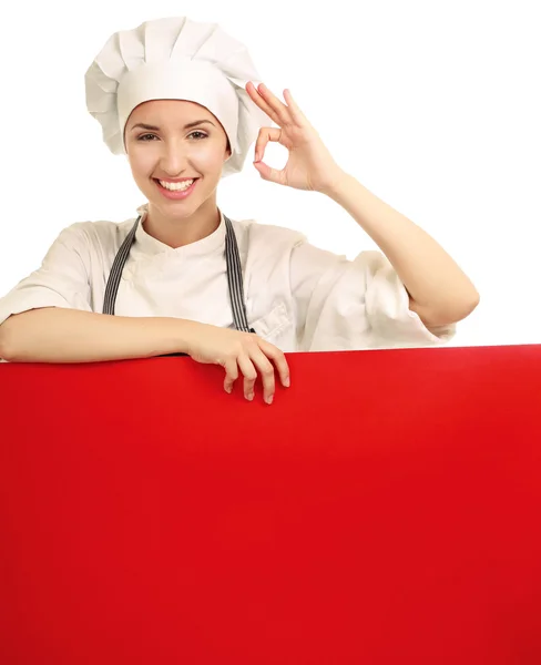 Chef mulher segurando uma placa em branco e mostrando ok — Fotografia de Stock