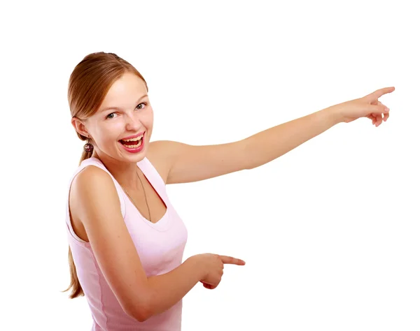 A young woman pointing at something — Stock Photo, Image