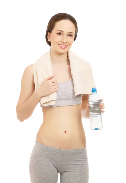 Mujer en un traje deportivo agua potable —  Fotos de Stock