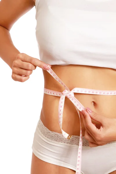 A slim girl measuring her waist, — Stock Photo, Image