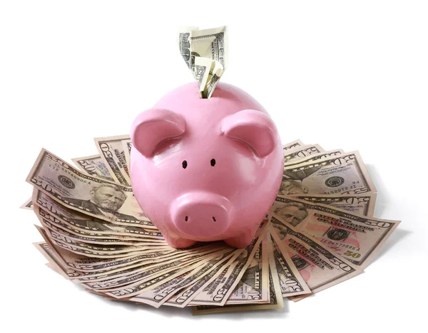 Piggy bank on dollars — Stock Photo, Image