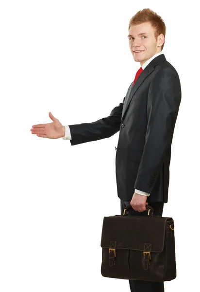 A young businessman giving his hand for a handshake — Stock Photo, Image