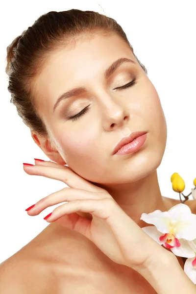 A young woman with orchid — Stock Photo, Image