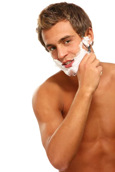 Closeup of a young man shaving — Stock Photo, Image