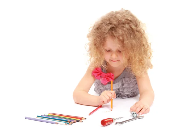 A happy little girl drawing with pencils — Stock Photo, Image