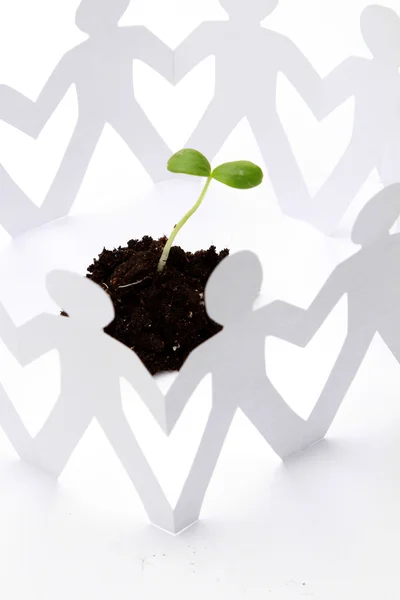 Paper people around a plant — Stock Photo, Image