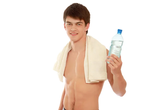 Jovem desportista com uma garrafa de água — Fotografia de Stock