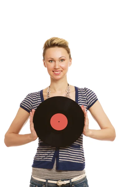 Una giovane donna con un disco in vinile — Foto Stock