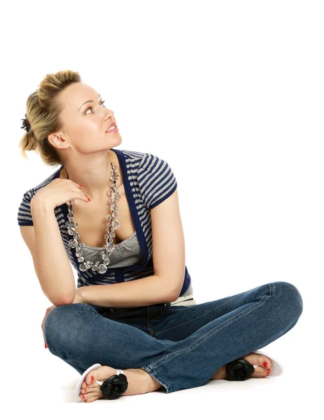 A young woman sitting on the floor — Stock Photo, Image