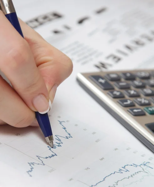 A close-up image of a hand with a pen Stock Photo