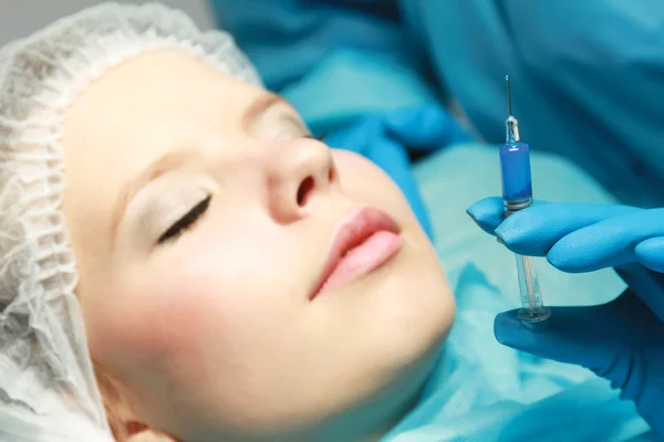 Young woman having an injection — Stock Photo, Image