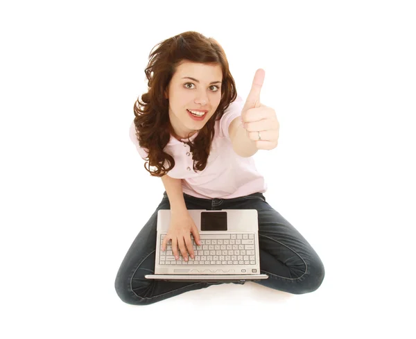 A young girl with a laptop sitting on the floor — Stock Photo, Image