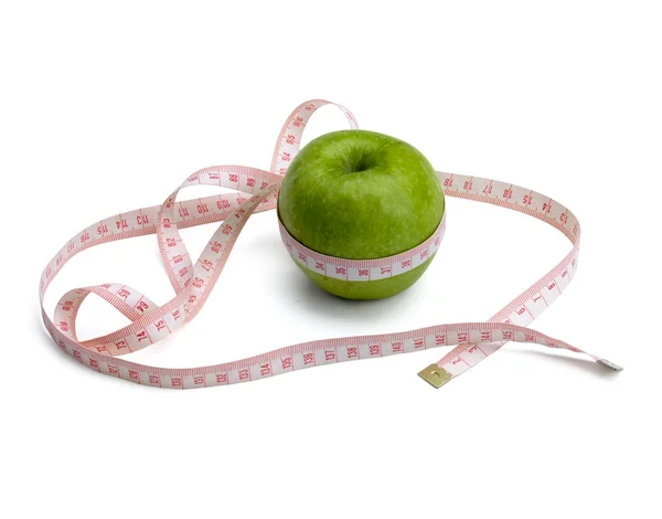 A green apple and a measurement tape — Stock Photo, Image