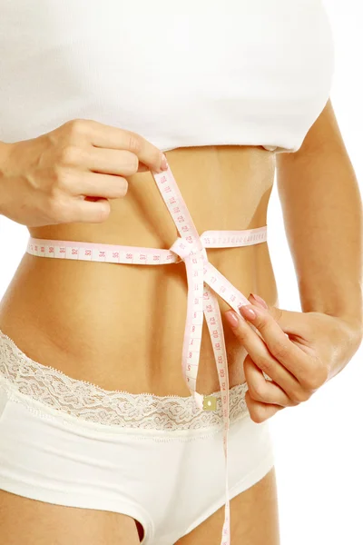 A female is measuring her waist — Stock Photo, Image