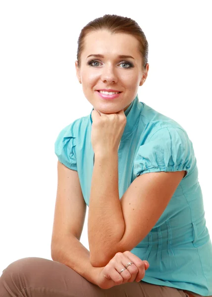A smiling woman sitting isolated — Stock Photo, Image