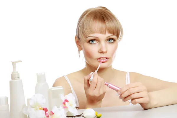 A beautiful woman using a lipstick, — Stock Photo, Image