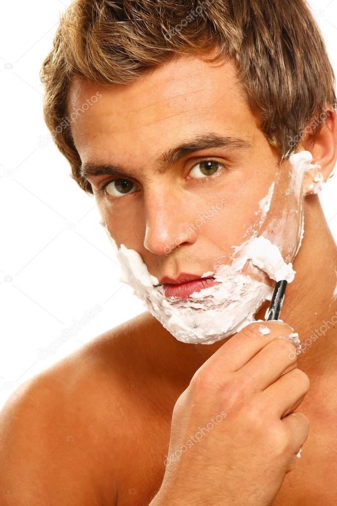 A shaving handsome man