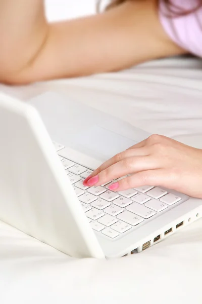 Close-up of a laptop and female hands — Stock Photo, Image