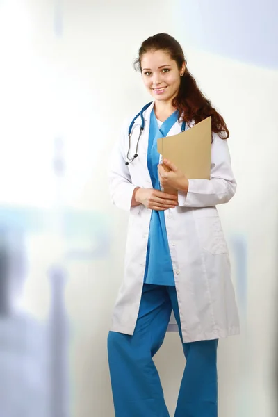 A portrait of a female doctor with a folder — Stock Photo, Image