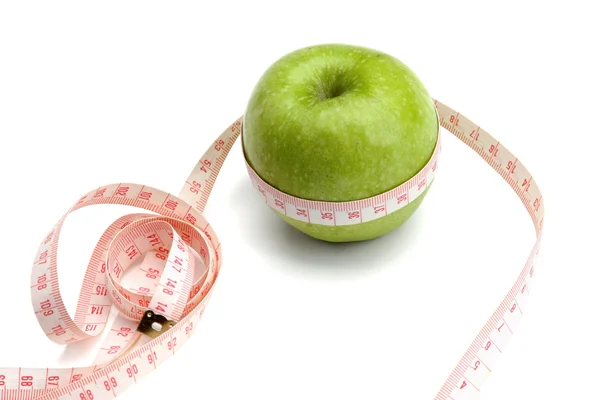Une pomme verte et un ruban à mesurer — Photo