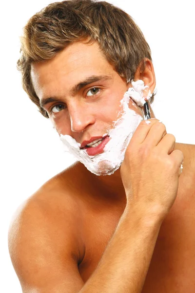 Closeup of a young man shaving — Stock Photo, Image