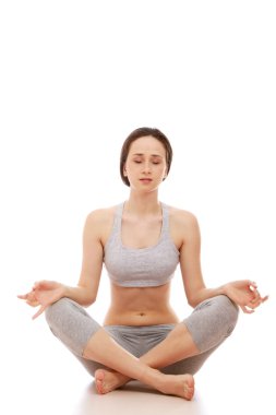 A young girl meditating