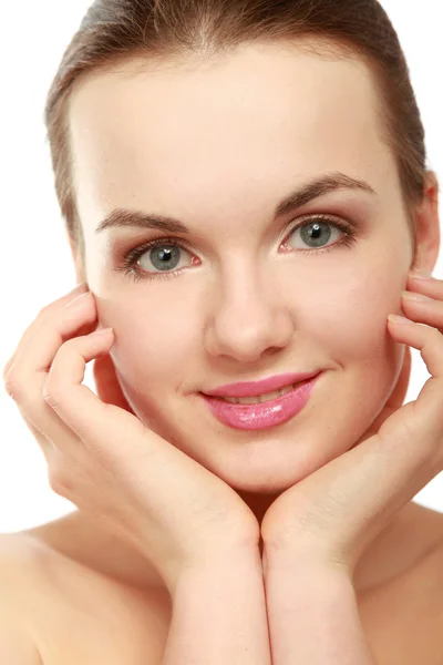 A beautiful young woman touching her face — Stock Photo, Image