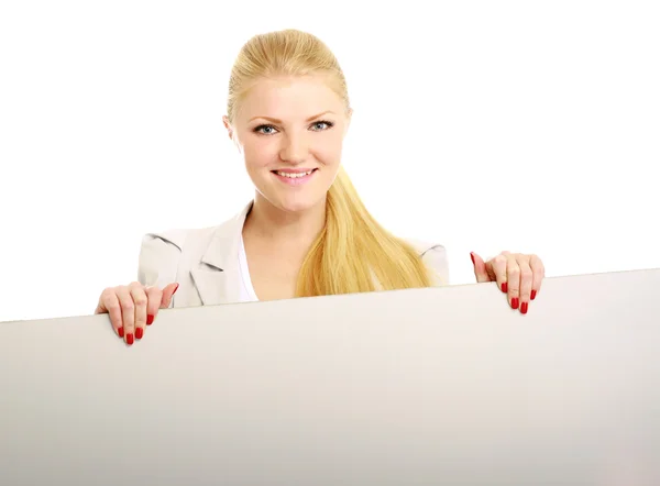 Jonge vrouw met een lege banner glimlachen — Stockfoto