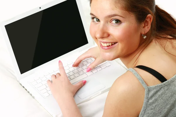 Close-up of happy girl typing — Stock Photo, Image