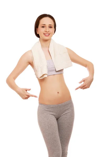 Sportive young woman with a towel — Stock Photo, Image