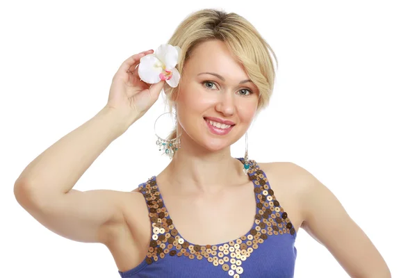 Woman putting a flower in her hair — Stock Photo, Image