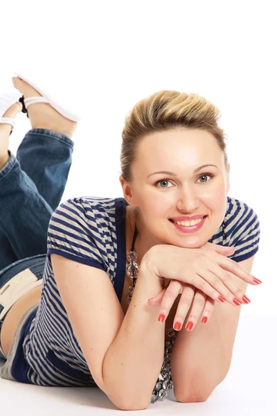 A lovely young woman lying on the floor — Stock Photo, Image