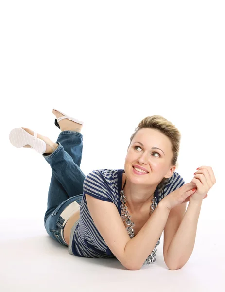 A lovely young woman lying on the floor — Stock Photo, Image