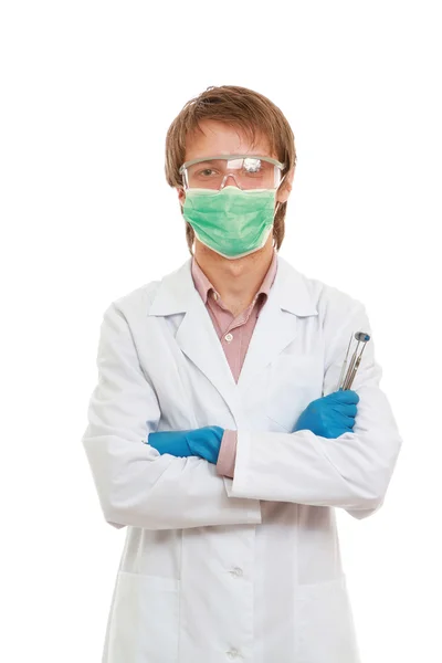 Odontólogo masculino con herramientas médicas — Foto de Stock