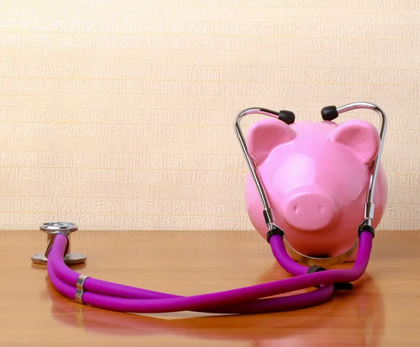 Piggy bank with stethoscope — Stock Photo, Image