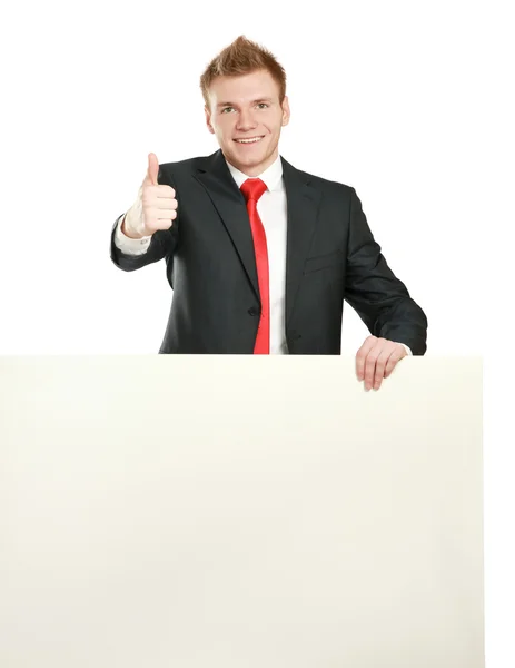 Young businessman with blank board — Stock Photo, Image